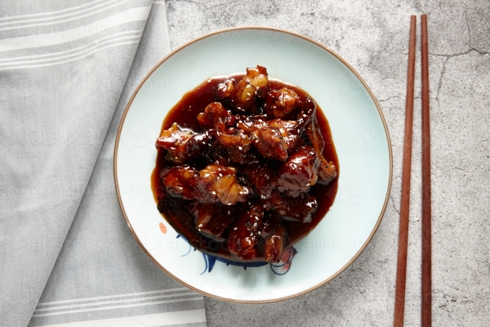 Marinated pork ribs dish on table - Australian Stock Image
