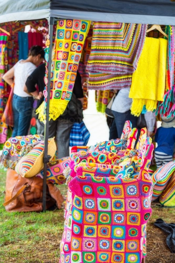 Market stall of brightly coloured crocheted items. - Australian Stock Image