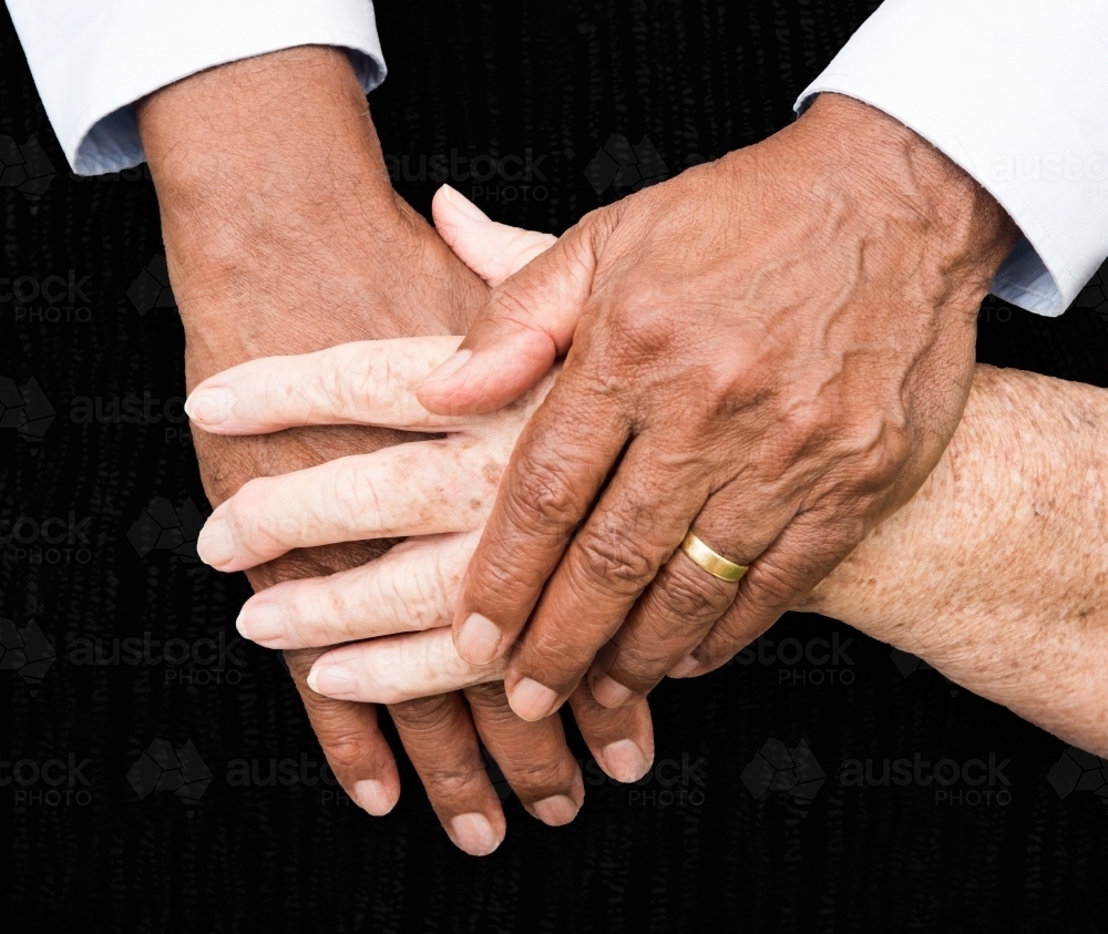 Married couple holding hands - Australian Stock Image