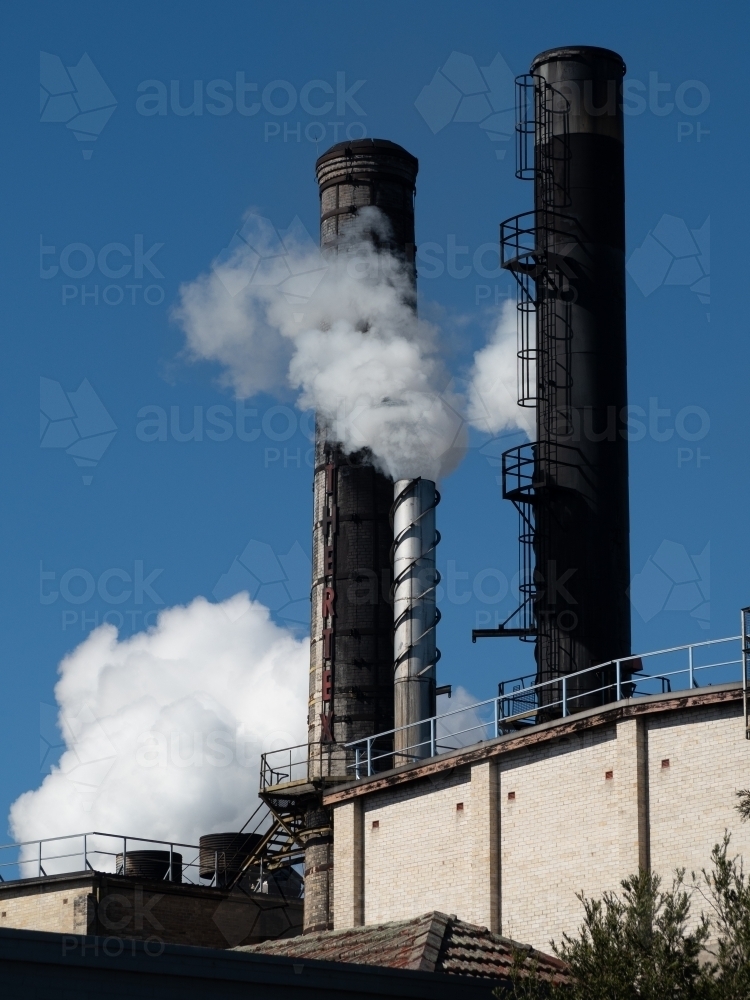 Masonite Factory Chimneys in Operation - Australian Stock Image