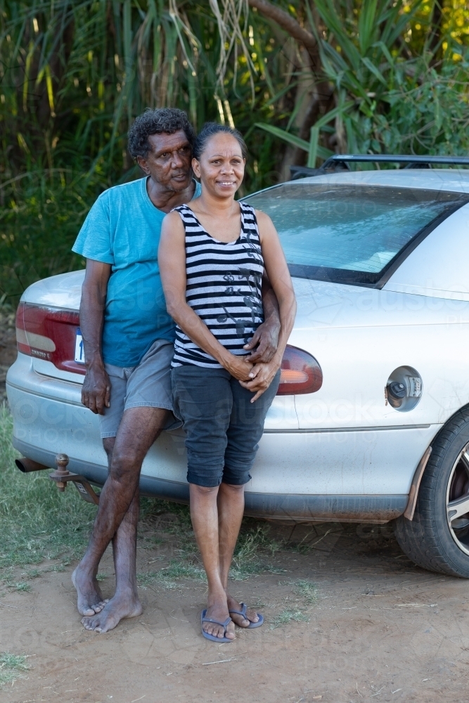 mature couple leaning against their car - Australian Stock Image