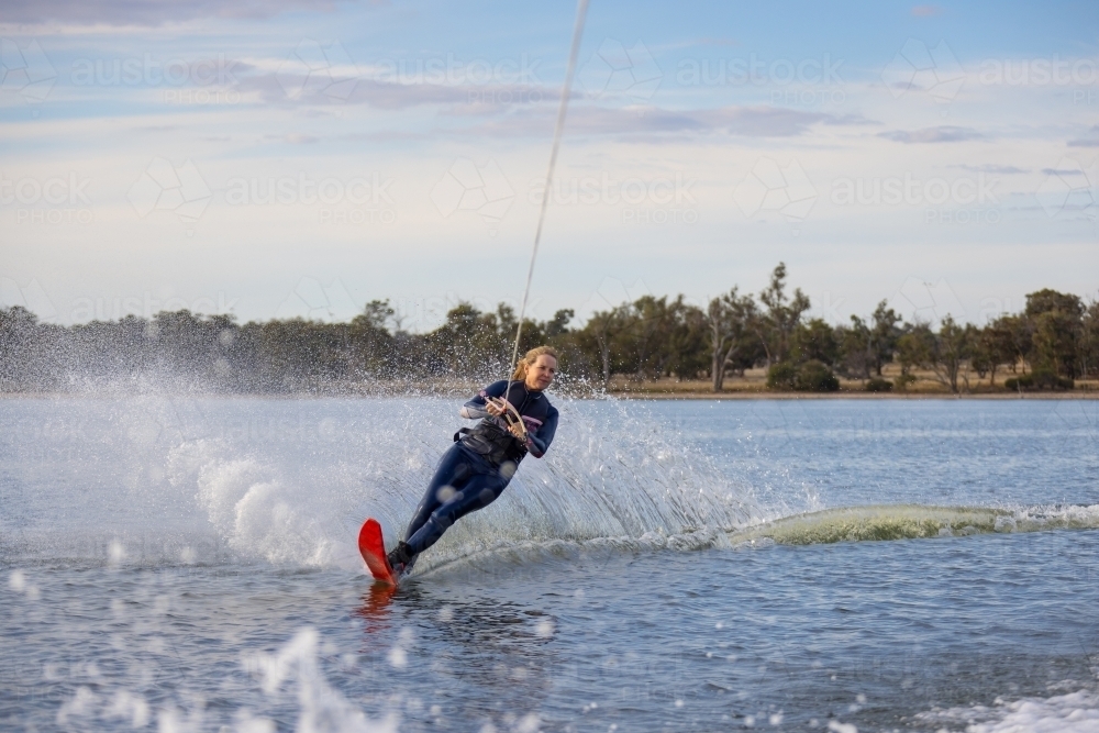 mature woman waterskiing on an inland lake - Australian Stock Image