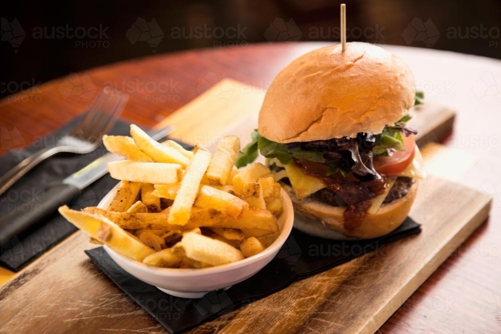 Meal of burger and fries in a cafe - Australian Stock Image