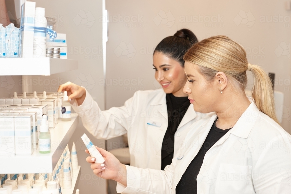 Medical practitioners selecting treatments at their practice - Australian Stock Image