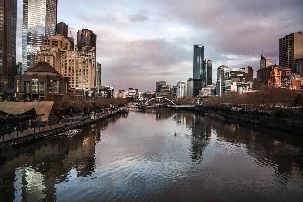Melbourne Southbank at dawn - the yarra river with rower - Australian Stock Image