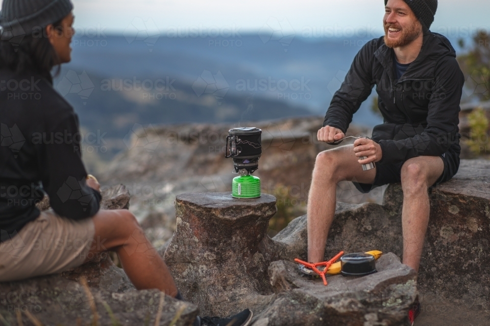 Men camping on mountains - Australian Stock Image