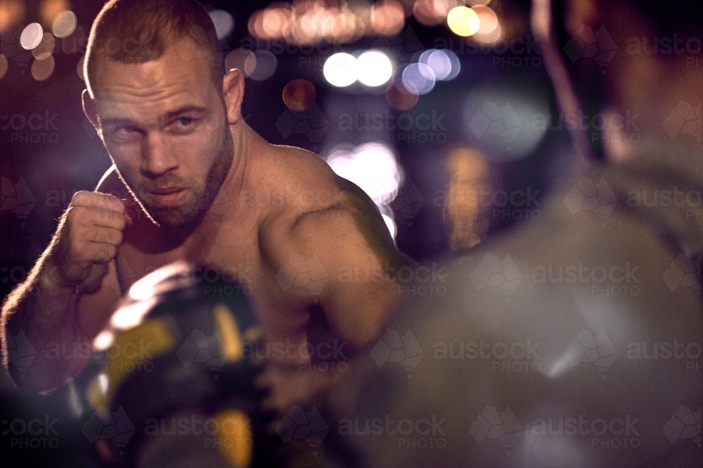 Men in urban city boxing fitness training - Australian Stock Image