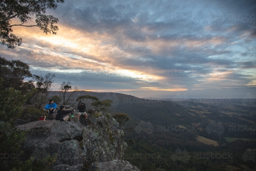 Men on cliff edge - Australian Stock Image