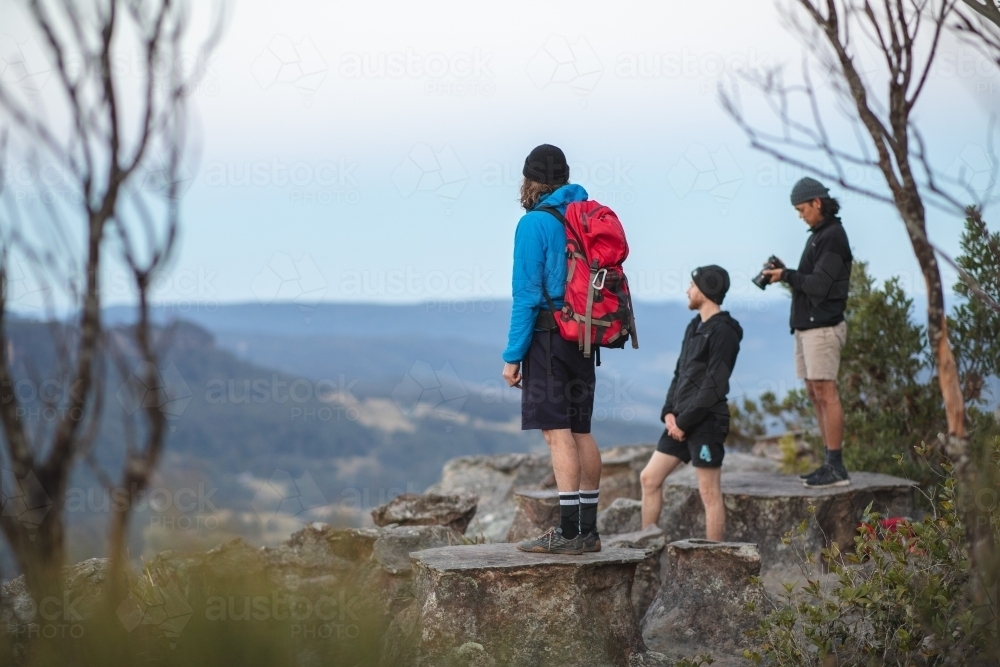 Men overlooking mountains - Australian Stock Image