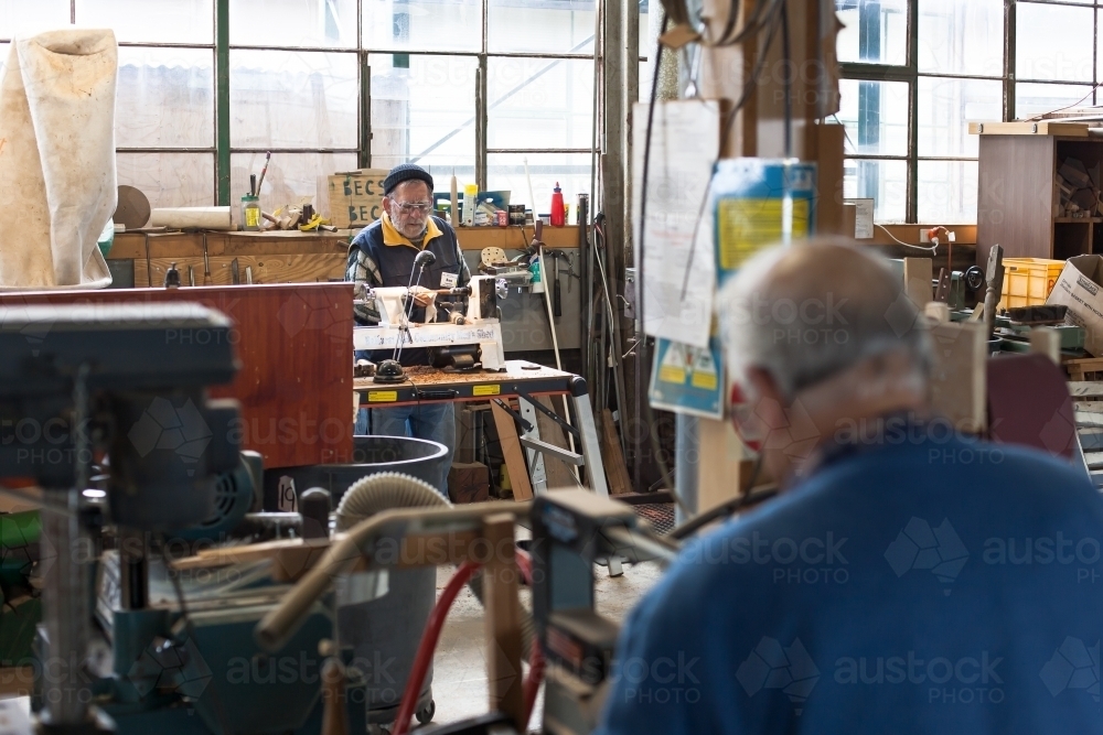 Men working at a men's shed - Australian Stock Image
