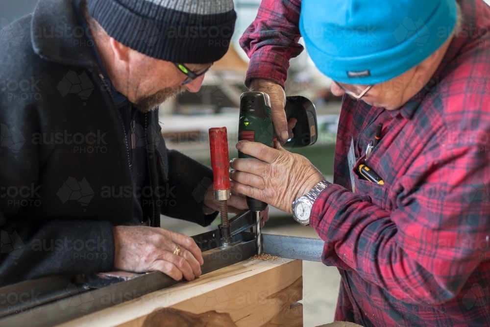 Men working together at a Men's Shed - Australian Stock Image