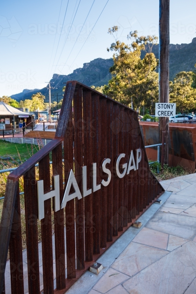 Metal sign displaying town name in the centre of Halls Gap - Australian Stock Image