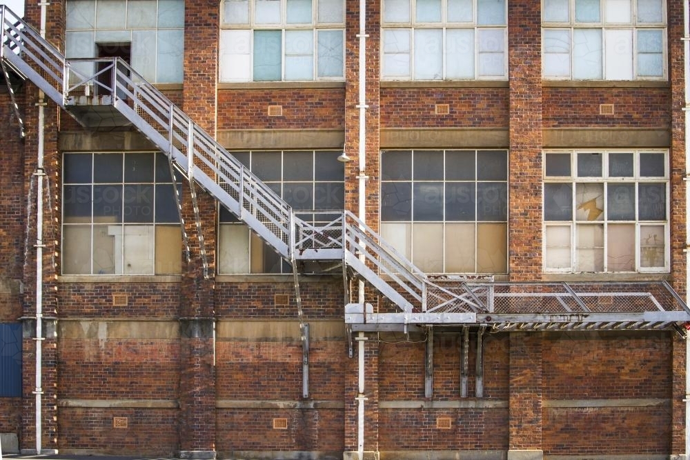 Metal stairs up the side of a historic factory in Launceston - Australian Stock Image