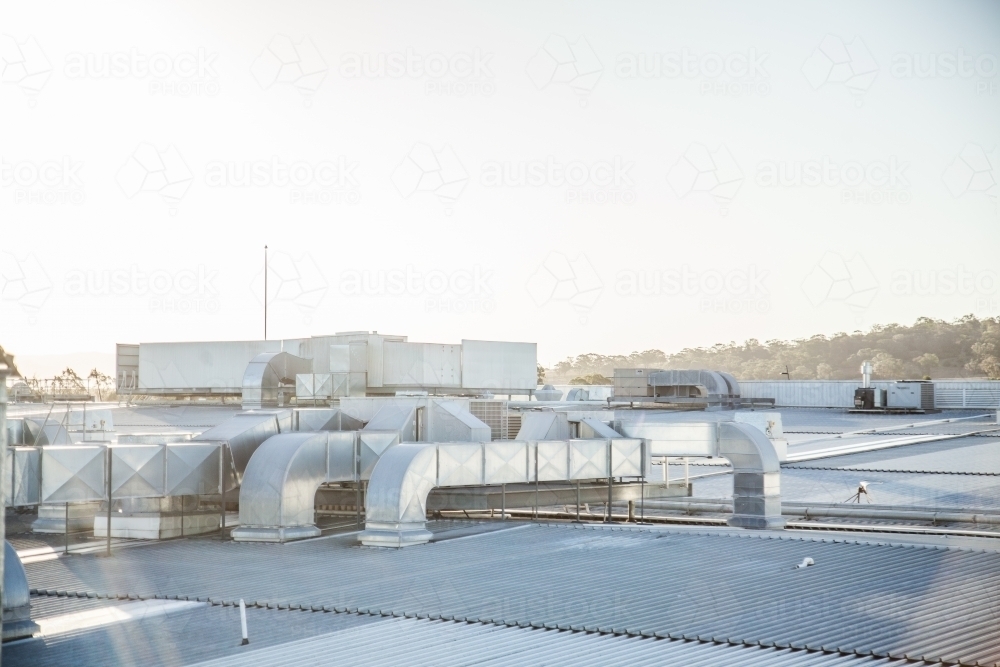 Metallic roof with vents shining in the sunlight - Australian Stock Image