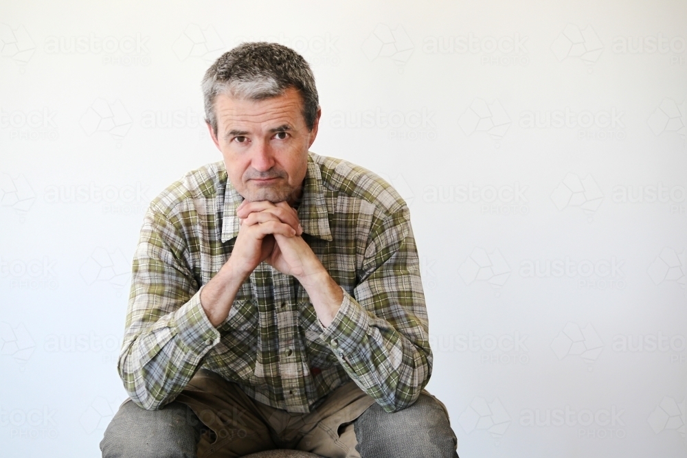 middle-aged man in work clothes - Australian Stock Image