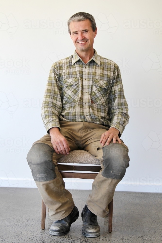 middle-aged man in work clothes - Australian Stock Image