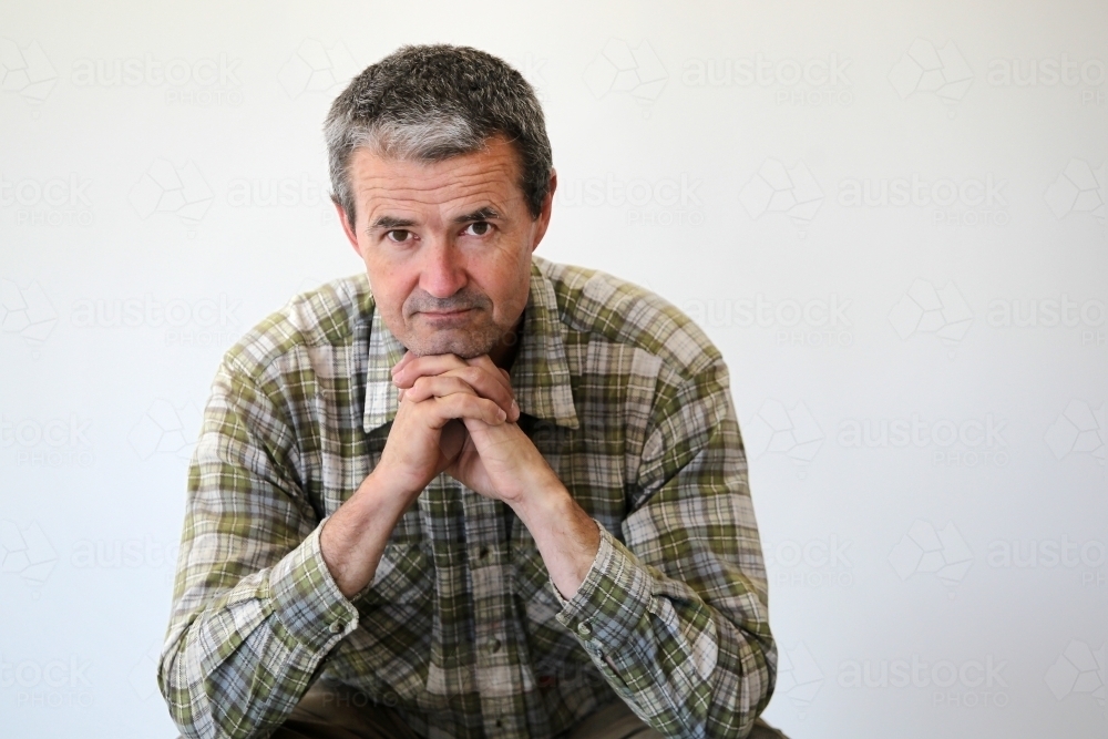 middle-aged man in work clothes - Australian Stock Image