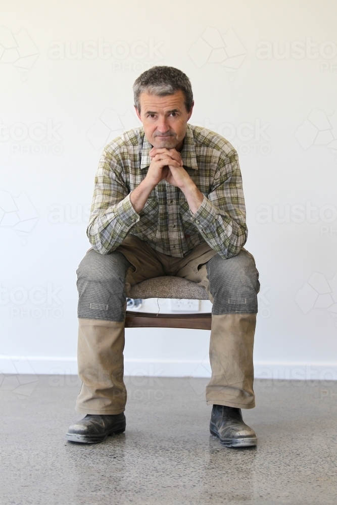 middle-aged man in work clothes - Australian Stock Image