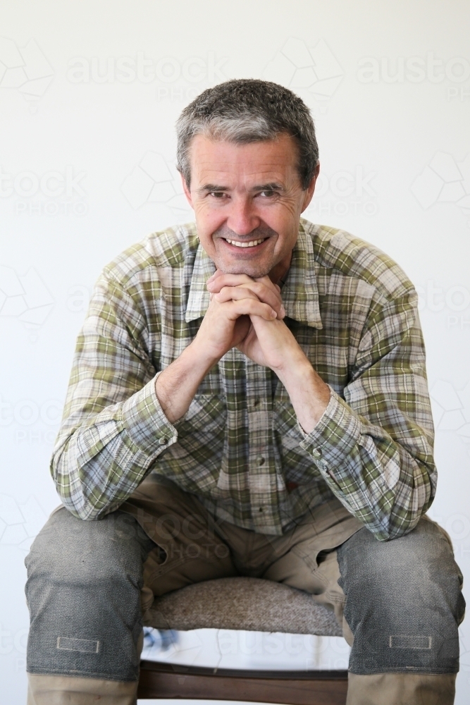 middle-aged man in work clothes - Australian Stock Image