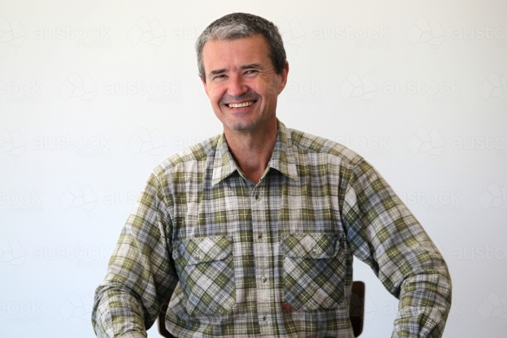 middle-aged man in work clothes - Australian Stock Image