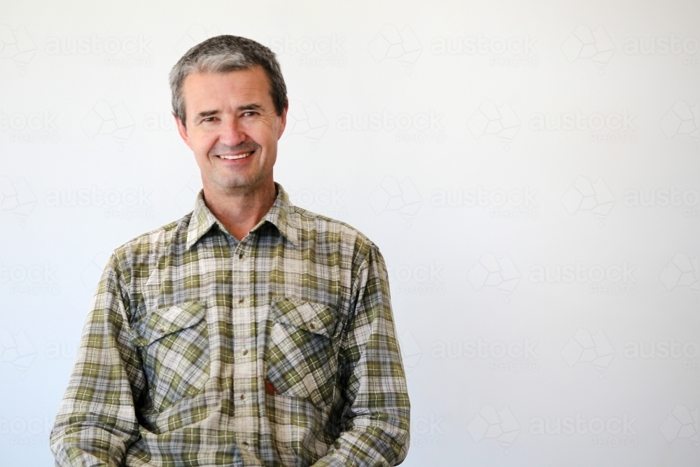 middle-aged man in work clothes - Australian Stock Image