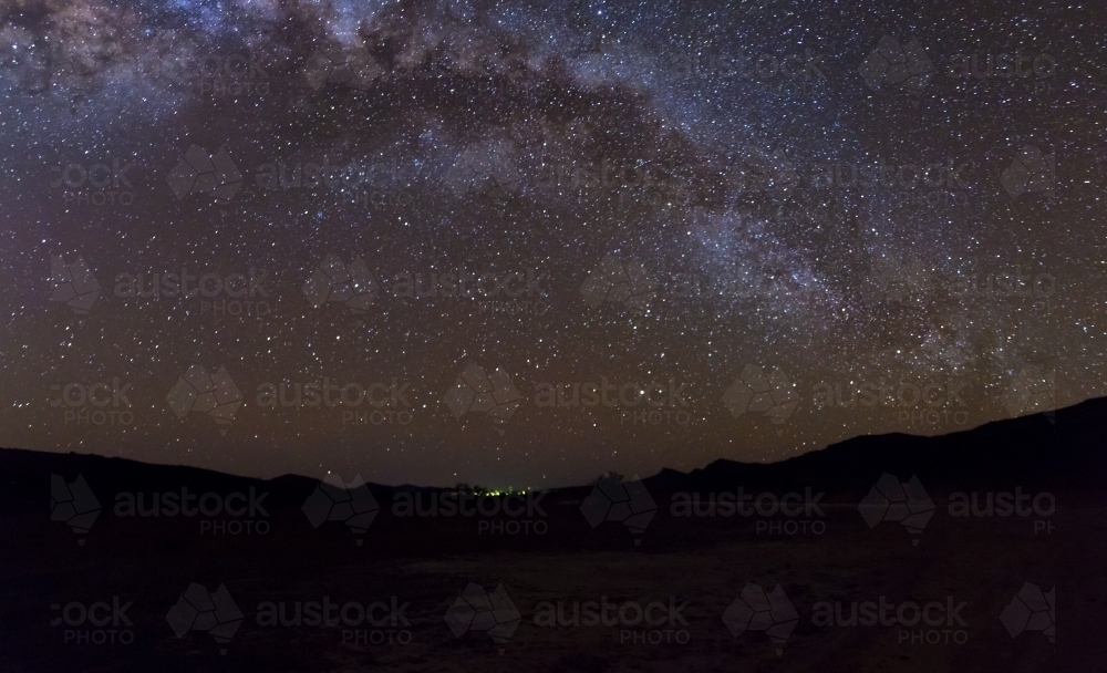 Milky Way arching over remote landscape - Australian Stock Image