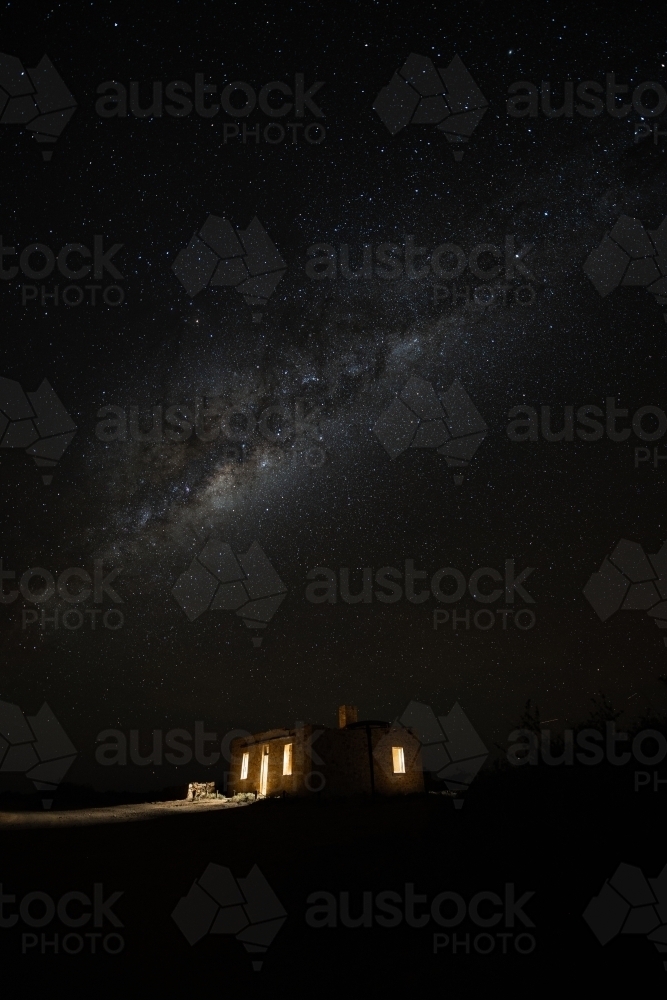 milky way over old stone building - Australian Stock Image