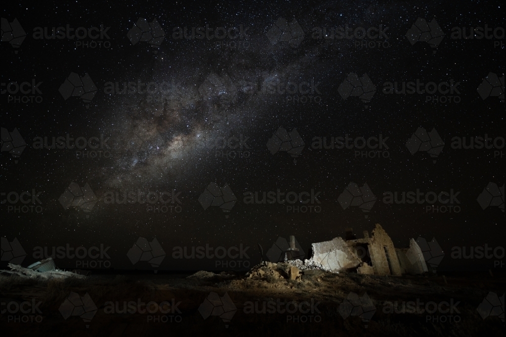 Milky Way over ruined stone building - Australian Stock Image