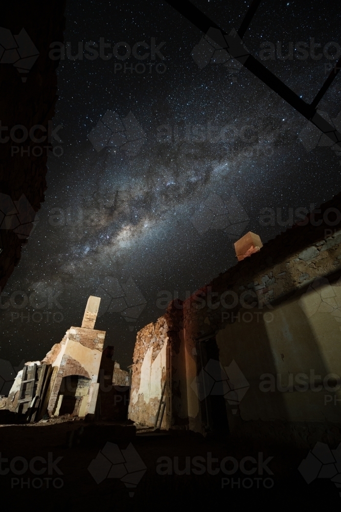 milky way over stone building - Australian Stock Image