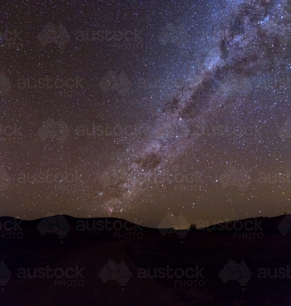 Milky Way rising over hills - Australian Stock Image