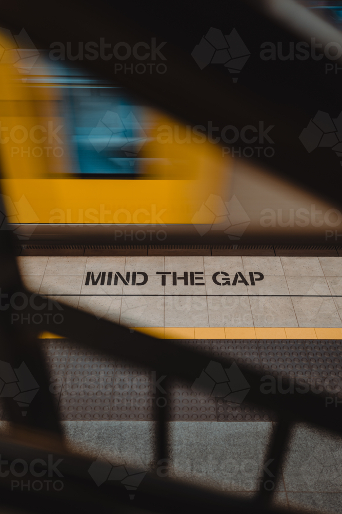 Mind the gap messaging on a train platform in Sydney - Australian Stock Image