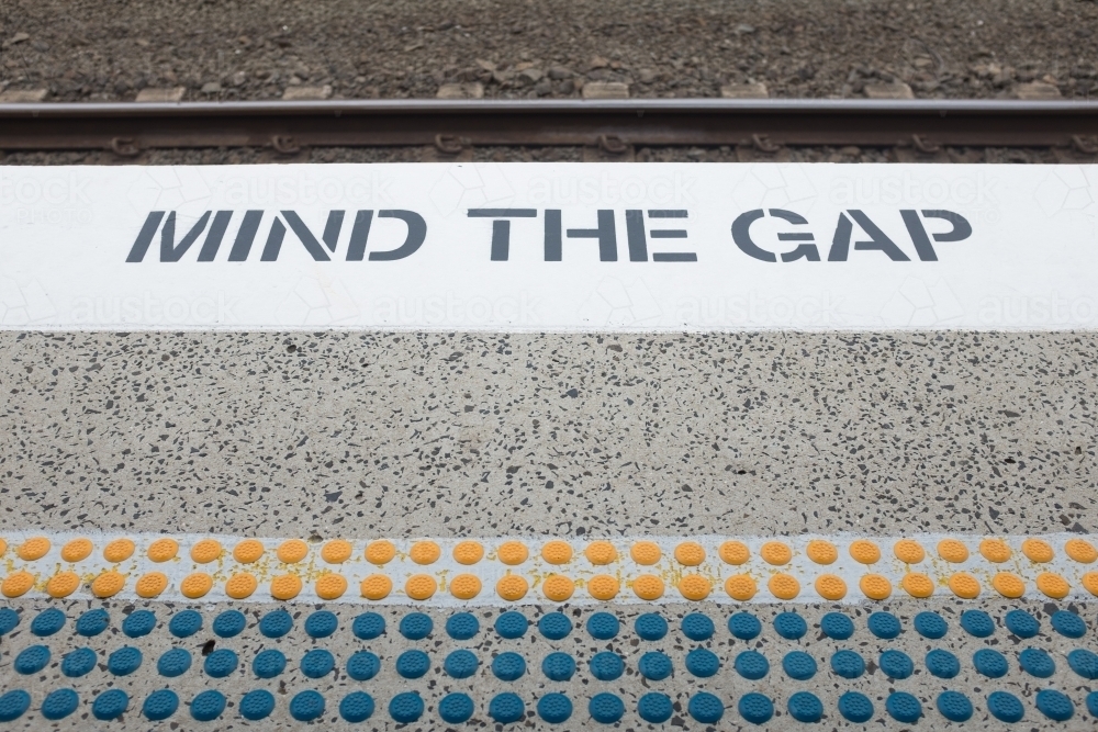 Mind the gap sign at a train station - Australian Stock Image
