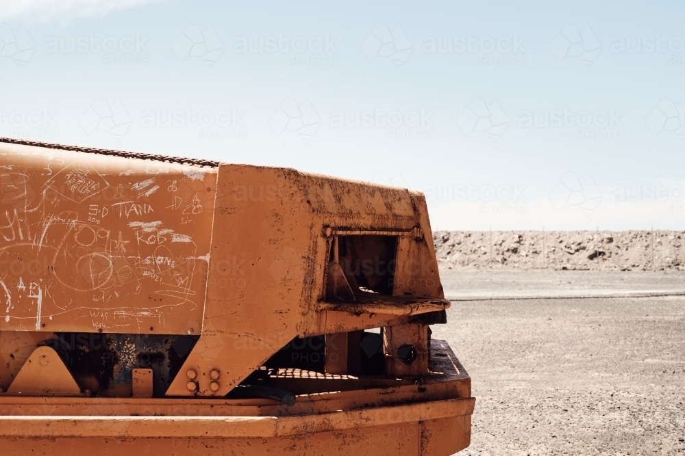 Mining loader bonnet in front of dusty desert landscape - Australian Stock Image