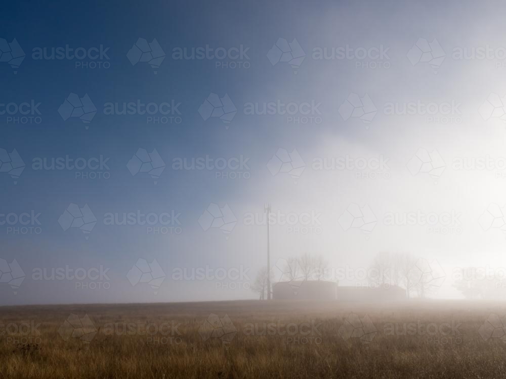 Mist clearing over reservoirs on a ridge - Australian Stock Image