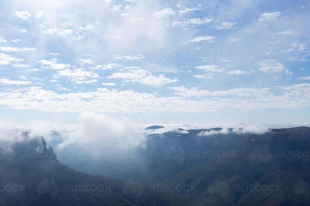 mist rising up to cloud above Blue Mountain valleys seen from Govetts Leap - Australian Stock Image