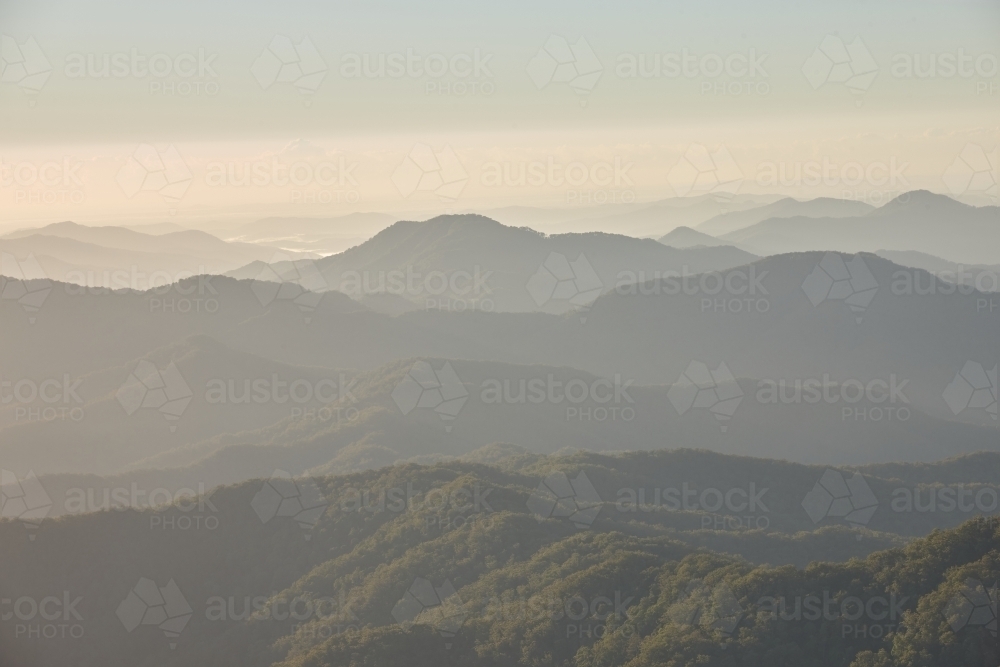 Misty mountain range during sunset - Australian Stock Image