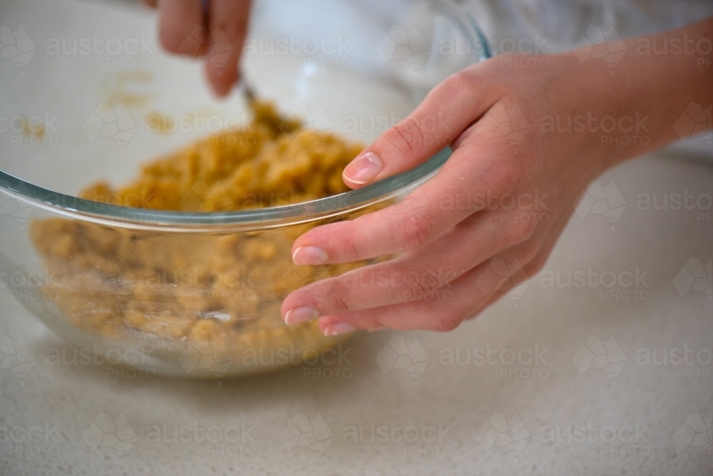 Mixing dough for cookies - Australian Stock Image