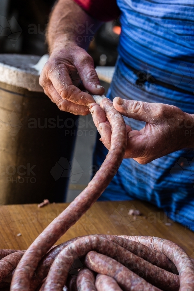 mobile butcher making sausages - Australian Stock Image