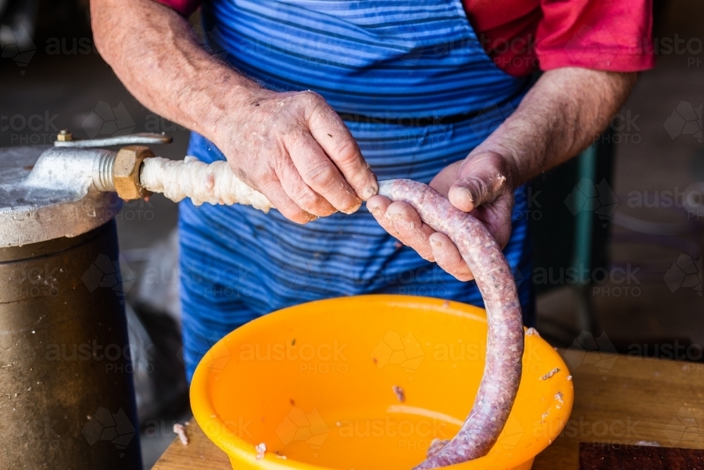 mobile butcher making sausages - Australian Stock Image