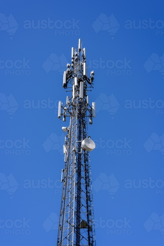 mobile phone communication repeater antenna. cell tower. on the blue sky background. - Australian Stock Image