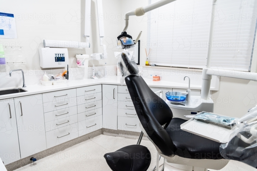 Modern dental treatment room with dental chair - Australian Stock Image
