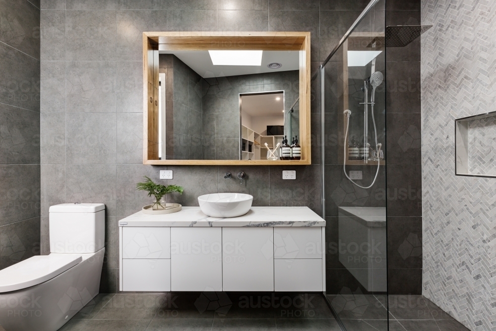 Modern designer bathroom with herringbone shower tiling - Australian Stock Image