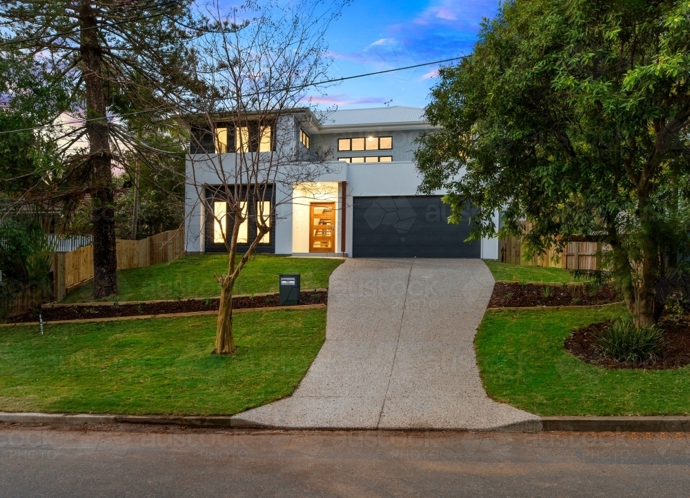 Modern new built double storey home, house exterior twilight - Australian Stock Image