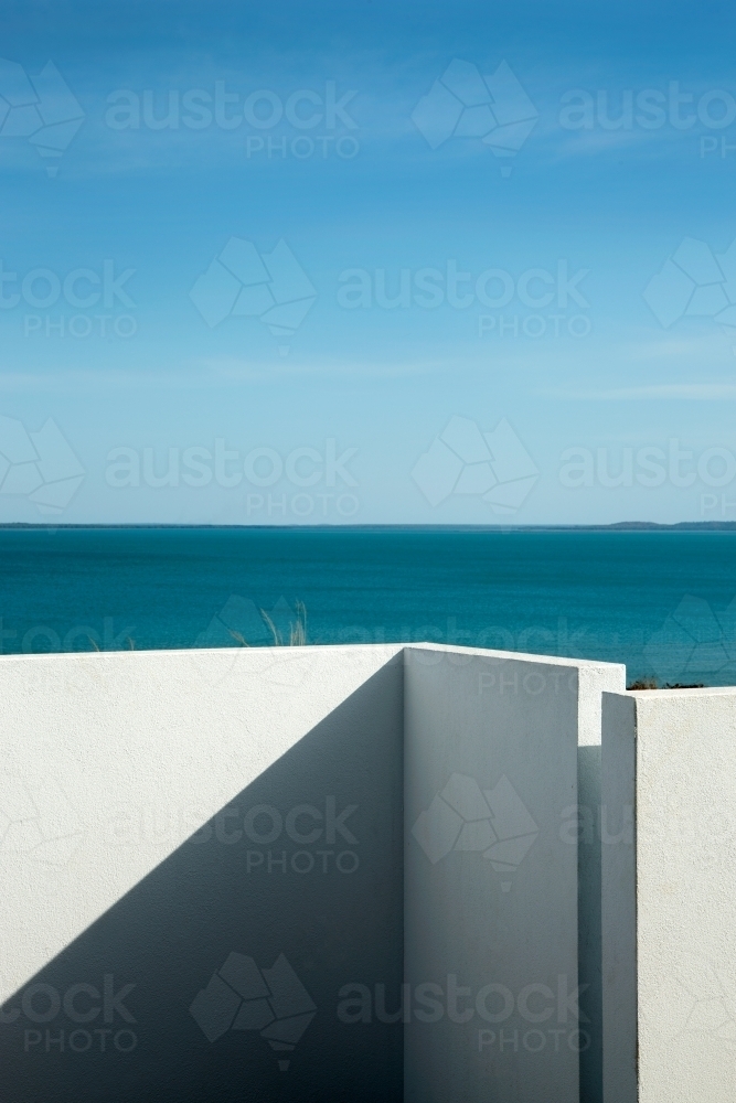 Modern outdoor courtyard with water views - Australian Stock Image