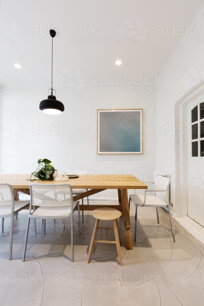 Modern scandinavian styled interior dining room with pendant light - Australian Stock Image