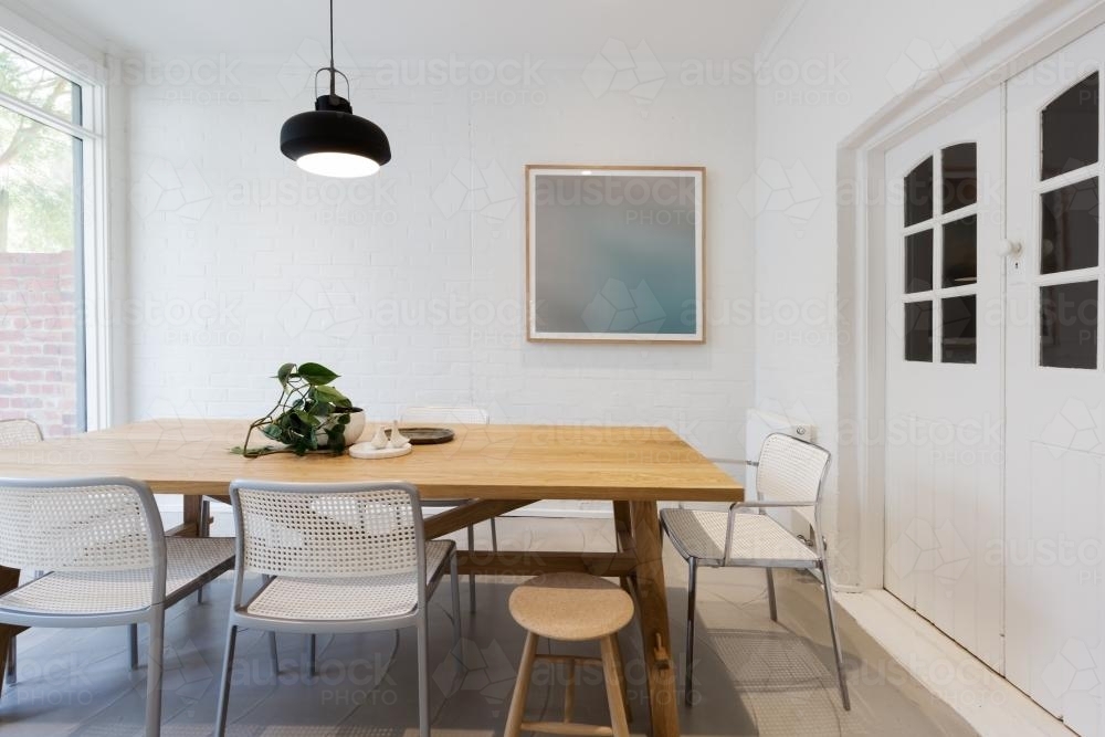 Modern scandinavian styled interior dining room with pendant light horizontal - Australian Stock Image