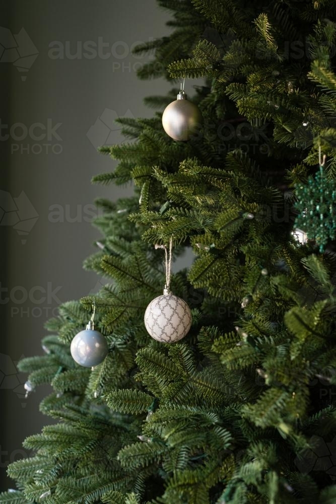 modern vintage xmas bauble on tree - Australian Stock Image