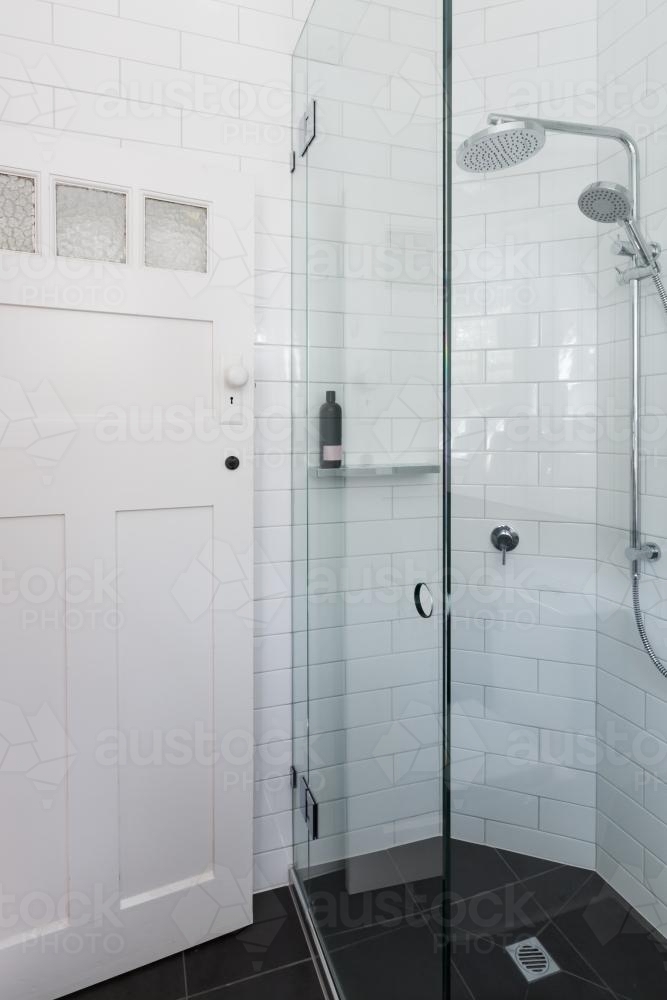 Modern white shower in bathroom renovation with brick pattern subway style tiling - Australian Stock Image