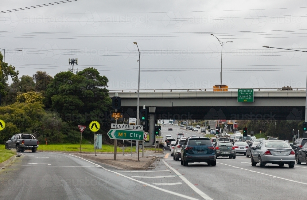 Monash freeway sign to M1 City with ramp signal on for entry - Australian Stock Image