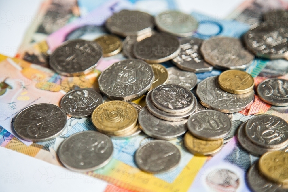 Money on australian notes with gold and silver coins - Australian Stock Image